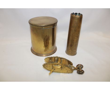 A trench art-style brass model of a First War tank, engraved 1916 2 Pdr shell case "Ypres 1915-16" and one other trench art s