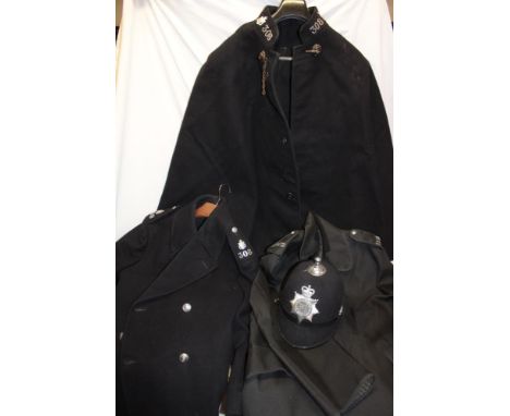 A Devon and Cornwall Constabulary Police helmet with helmet plate together with relating Cornwall Constabulary cloak, great c