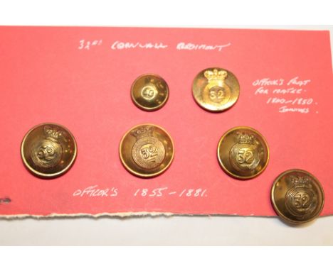Six various 32nd (Cornwall) Regiment of Foot tunic buttons including early 19th century gilt coatee button and others, etc