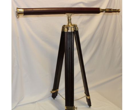A good quality modern brass and leather mounted telescope on brass mounted folding tripod
