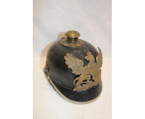 An Imperial German leather pickelhaube with brass mounts and Baden plate with leather liner
