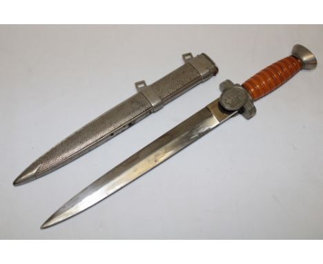 A Second War German Nazi Red Cross Leaders dagger with 10" double edged steel blade, plated traditional hilt with orange grip