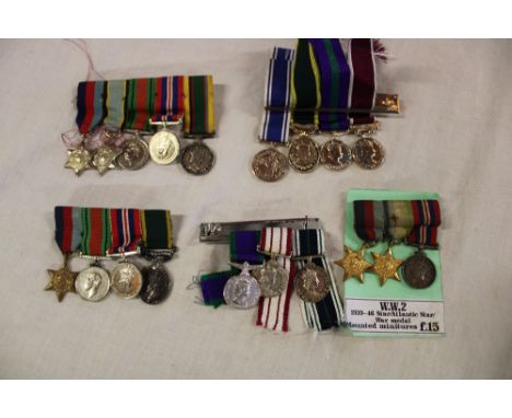 A selection of miniature medals in groups and singles including Territorial Efficiency medal, Air Crew Europe star, Cadet For