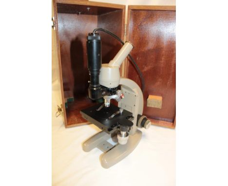 A monocular microscope by Vickers Instruments in fitted wooden case