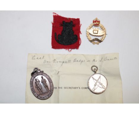 A gilt and enamelled Royal Tank Regiment Sweethearts badge, cloth formation sign, silver shooting medal and one other medalli