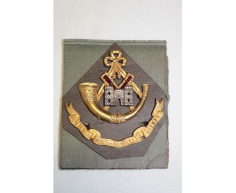 A Victorian Officer's silver gilt two-part forage cap badge of the Duke of Cornwall's Light Infantry circa. 1881-1900