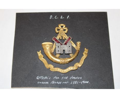A late Victorian Officer's silver gilt two-part forage cap badge of the Duke of Cornwall's Light Infantry (circa. 1881-1900)
