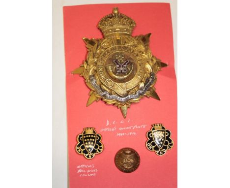 A post-1902 Officer's silver gilt helmet plate of the Duke of Cornwall's Light Infantry together with a pair of enamelled Off