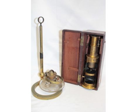 A 19th century Culpepper-style brass microscope in fitted mahogany case and a brass specimen stand with oil lamp burner