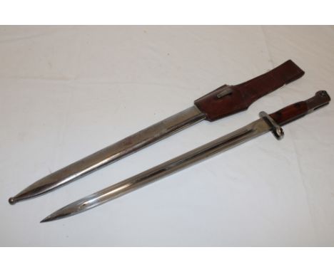 A Second War Czech bayonet with 15" single edged blade in steel scabbard with leather frog