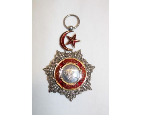 A Turkish Order of the Medjidie in silver, gilt and red enamel