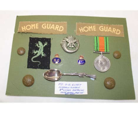 A selection of badges and insignia formerly the property of Pte. G. O. Cary, Coverack Platoon 8th Lizard Home Guard including