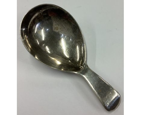 A Victorian silver caddy spoon bearing English import marks. Circa 1890. Approx. 12 grams. Est. £40 - £60.
