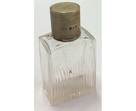 ASPREY &amp; CO: An engine turned silver scent bottle. London 1912. Est. £20 - £30.
