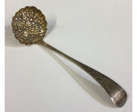 A 19th Century George III silver sifter ladle with berry decoration. London 1810. Approx. 19 grams. Est. £30 - £40.