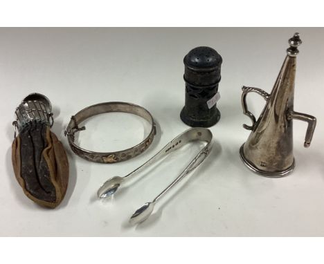 A silver bangle, pepper etc. Approx. 55 grams. Est. £20 - £30.