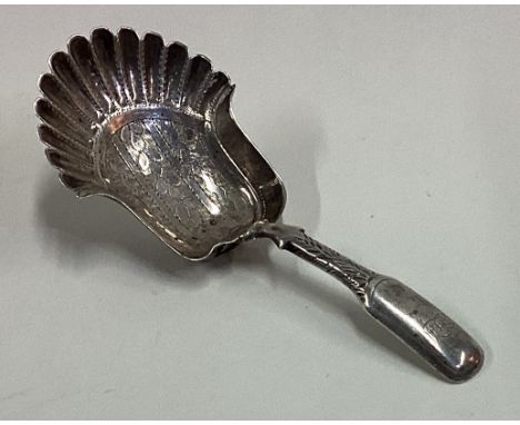 A 19th Century silver caddy spoon with bright-cut decoration to bowl. Approx. 10 grams. Est. £20 - £30.