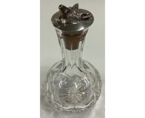 OF HUNTING INTEREST: A silver mounted and glass whisky liqueur bottle. London 1977. Est. £60 - £80.
