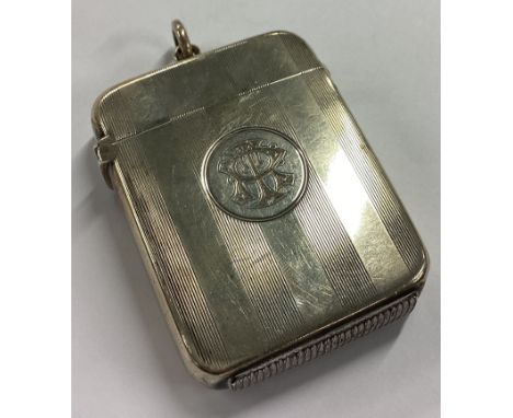 A heavy silver vesta case with engine turned decoration. Birmingham. By GU. Approx. 51 grams. Est. £30 - £50.