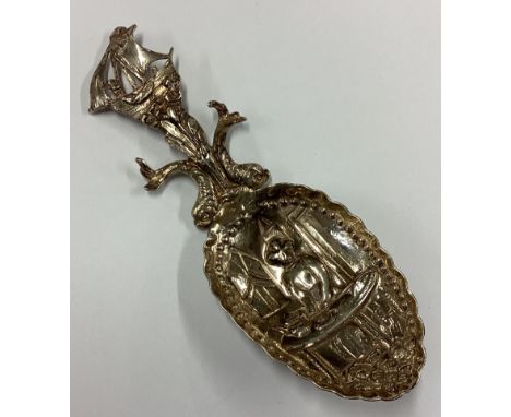 A 19th Century Dutch silver caddy spoon embossed with Chinoiserie decoration. Approx. 29 grams. Est. £30 - £40.