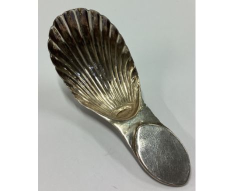 A Georgian silver caddy spoon. London 1797. Approx. 5 grams. Est. £20 - £30.