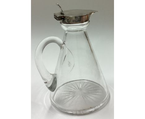 A silver mounted and glass whisky noggin. Birmingham 1912. Est. £30 - £40. 