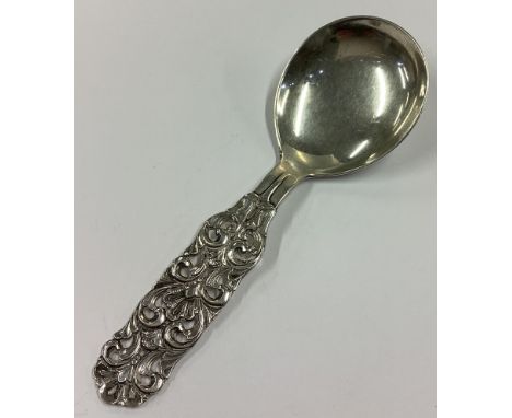 A Continental silver caddy spoon with pierced handle. Approx. 22 grams. Est. £20 - £30.