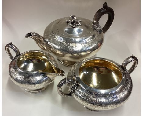 A good Victorian silver three-piece tea service. London. By WC. Approx. 888 grams. Est. £300 - £400.