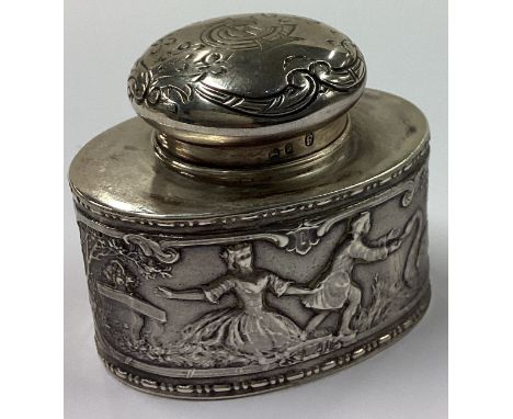 A novelty Victorian silver tea caddy embossed with figures bearing import marks. Marked to base. By Berthold Muller. Approx. 