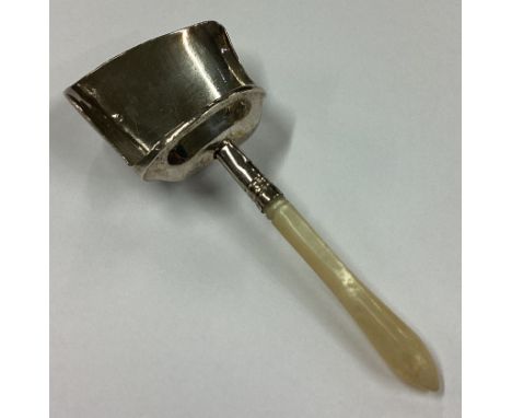 A Georgian silver caddy scoop with tapering handle. Birmingham. By Samuel Pemberton. Approx. 7 grams. Est. £30 - £40.