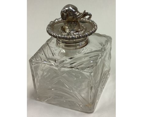 A rare Victorian silver and glass inkwell cast with elephant finial. London 1872. By George Fox. Est. £150 - £200.