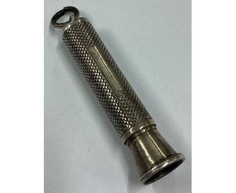 An engine turned silver pencil. Approx. 8 grams. Est. £10 - £20.