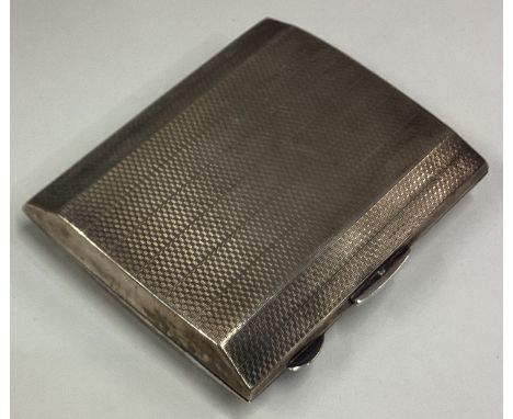 A heavy silver cigarette box with engine turned decoration. Approx. 100 grams. Est. £30 - £50.