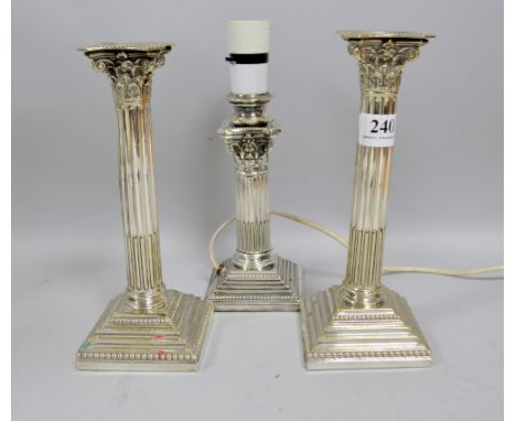 A pair of silver plated Corinthian column candlesticks, 23cm and a similar Walker and Hall stick