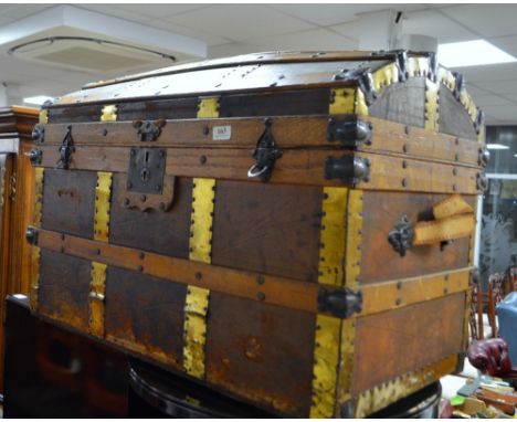 Early 20th century slatted dome top trunk with fitted interior.