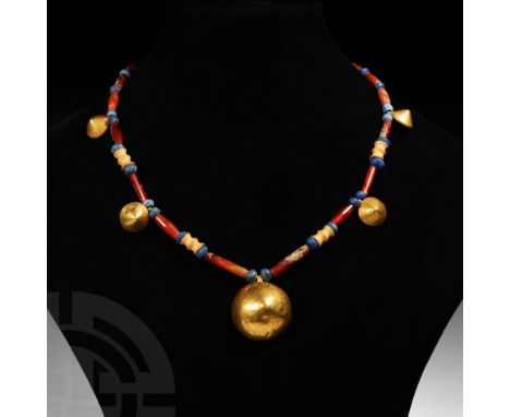 2nd millennium BC. A restrung necklace composed of carnelian, lapis lazuli and gold beads including tubular, biconical, squar