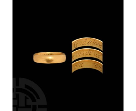 18th century AD. A gold D-section annular band with plain outer face, the internal face inscribed 'God alone made us one' in 