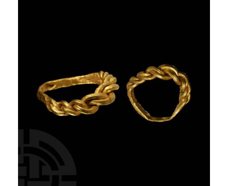 10th-11th century AD. A gold annular band with rectangular-section hoop, plaited wire bezel and shoulders composed of three f