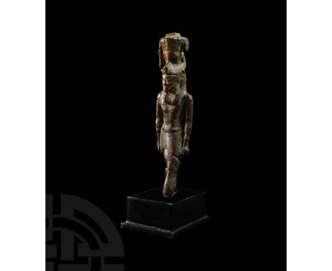 26th Dynasty, 664-525 BC. A bronze amuletic statuette of the Egyptian god Nefertum, modelled in the round advancing forwards,