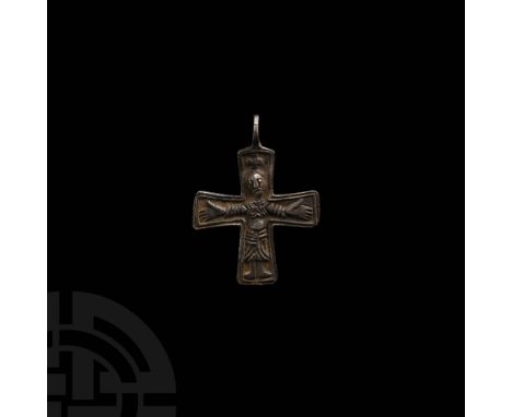 10th-11th century AD. A silver pectoral cross with pierced lug at the apex, raised linear borders enclosing a facing Corpus C