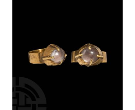 c.12th century AD. A gold finger ring comprising a flat-section hoop and conical bezel with applied claw setting; inset chrys