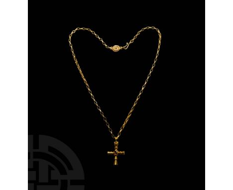 10th-12th century AD. A substantial gold necklace composed of a loop chain and cross pendant, the chain with hook-and-loop cl