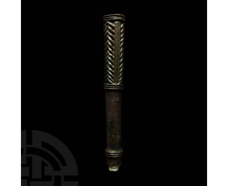 Late 3rd millennium BC. A bronze mace head comprising a long cylindrical shaft with narrow flanged base partially preserved, 