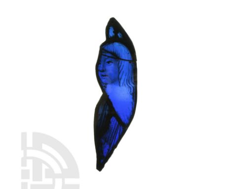 England, c.1505-1515 AD. An irregular stained glass panel with lead-alloy frame; deep blue field with painted image of an ang