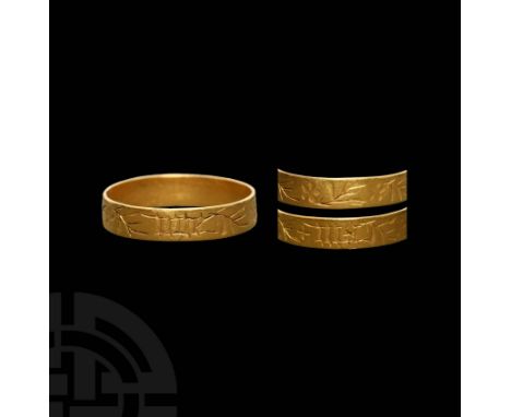 14th-15th century AD. A gold flat-section annular band, engraved around the exterior with stylised flower-and-sprig ornament 