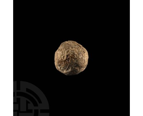 Uruk Period, c.55th-31st century BC. A sealed spherical clay bulla envelope containing clay tokens which can be heard rattlin