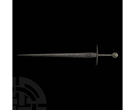 14th century AD. An iron longsword of Oakeshott's Type XV.A with tapering, pointed blade of flattened diamond section, the ed