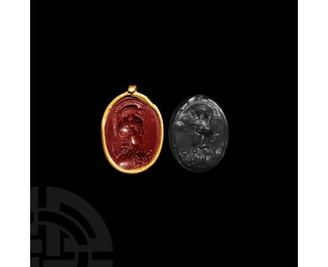 1st century AD. A red jasper gemstone with a gold mount, depicting the bust of goddess Athena Parthenos (Greek Minerva), wear