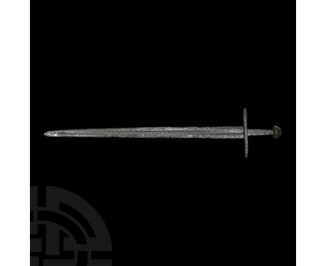 10th-12th century AD. A double-edged Viking or Norman sword of Petersen Type X, well-defined cutting edges and fullers to the