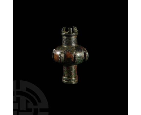 9th century BC or earlier. A bronze mace head with squat, bulbous body, medial band of ornament alternating between large ovo